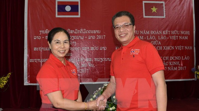 ĐSQ Việt Nam và Lào tại Trung Quốc củng cố tình hữu nghị truyền thống Đại sứ đặc mệnh toàn quyền nước CHXHCN Việt Nam Đặng Minh Khôi và Đại sứ Lào Vandy Bouthasavong trong buổi giao lưu. (Ảnh: Lương Tuấn/TTXVN)