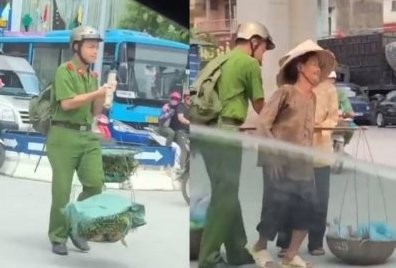 Nam sinh cảnh sát giữa trưa nắng giúp 2 bà cụ gánh rau qua đường Nam sinh gánh rau giúp đỡ bà cụ khiến nhiều người cảm động. Ảnh cắt từ clip.