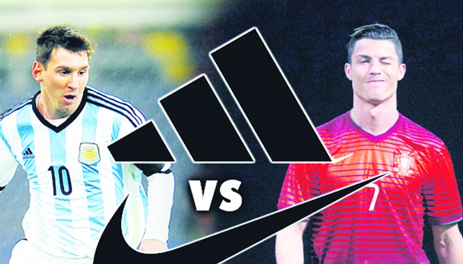 World Cup: Cuộc chiến giày và áo Hai ngôi sao Messi và Ronaldo đại diện cho cuộc chiến của hai hãng trang phục thể thao hàng đầu thế giới. Ảnh: The Sun