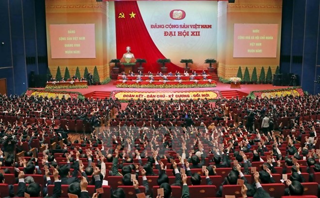 248 điện mừng Đại hội Đảng XII từ các đảng, tổ chức quốc tế Các đại biểu biểu quyết thông qua Nghị quyết Đại hội XII Đảng Cộng sản Việt Nam. (Nguồn: TTXVN)