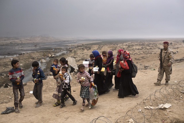 IS dùng hàng vạn người dân Iraq làm lá chắn sống Ảnh: UN