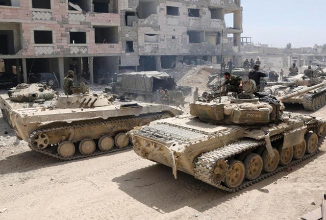 Mỹ dọa tấn công quân sự Syria: 'Bom hẹn giờ' khó nổ Xe tăng Syria trong chiến dịch chiếm lại Đông Ghouta. Ảnh: Getty Images.