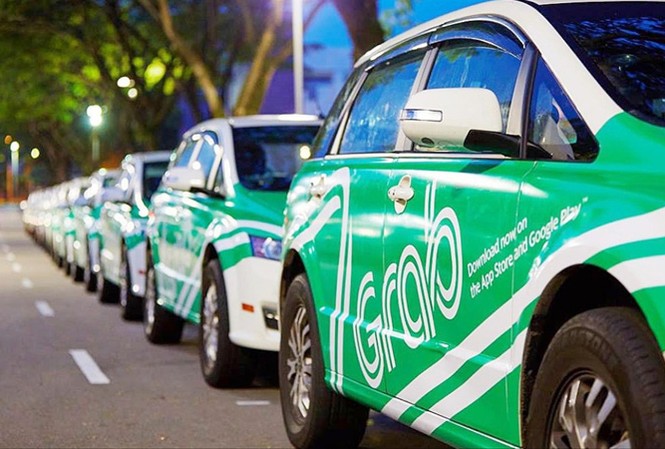 Hà Nội đồng thuận dừng nhân rộng thí điểm Uber, Grab Theo Bộ trưởng Bộ GTVT, không cấm, nhưng Uber, Grab phải tuân thủ pháp luật. Ảnh: Today online.