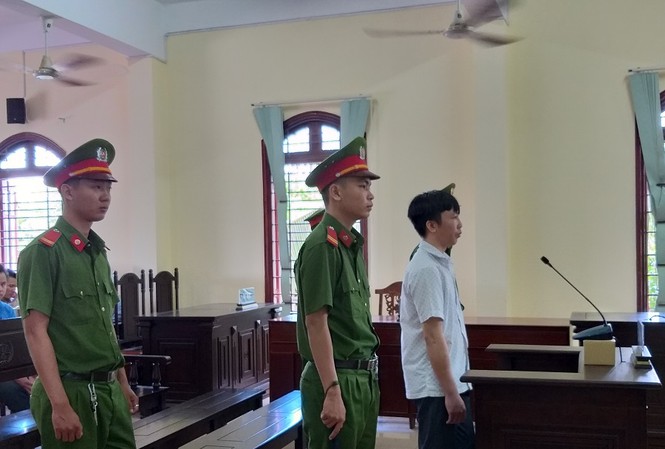 Đại úy Công an lừa chạy việc lĩnh 13 năm tù Bị cáo Huy tại tòa - Ảnh: Kim Hà