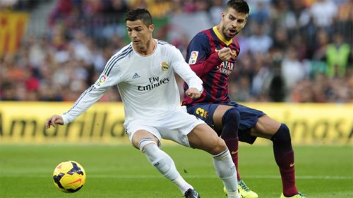Pique đề cao Ronaldo trước trận El Clasico Ronaldo đang có thành tích ghi bàn khả quan khi gặp Barca. Ảnh: Reuters