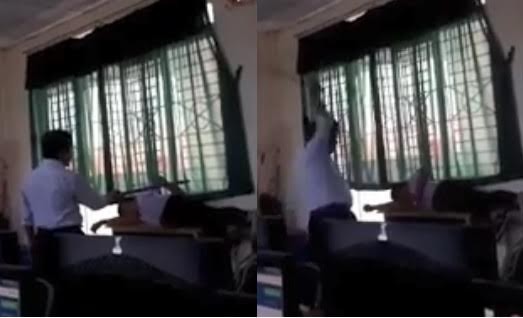 Học sinh rên la, lăn lộn trên bàn sau cú đập gậy của thầy giáo Hình ảnh cắt từ clip