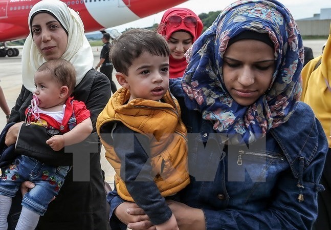 Bản tin 14H: 5 vạn người tị nạn Syria ùn ùn trở về từ Thổ Nhĩ Kỳ Người tị nạn Syria. (Nguồn: AFP/TTXVN)
