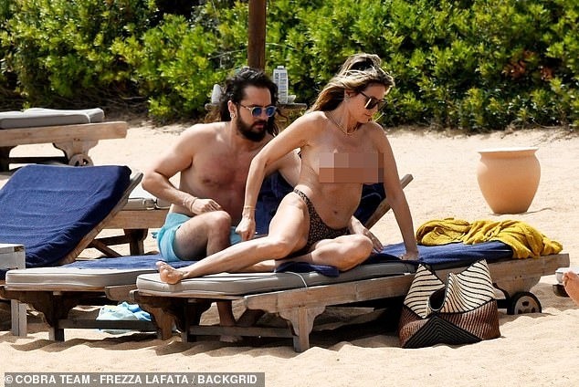 Heidi Klum cởi bikini để tắm nắng gây tranh cãi ảnh 9