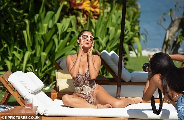Lingerie model Demi Rose poses seductively for photos, showing off her eye-catching chest in photo 3