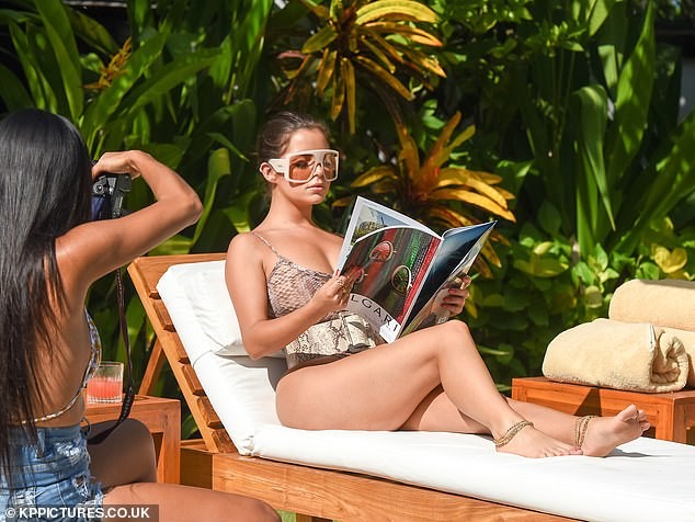 Lingerie model Demi Rose poses seductively for photos, showing off her eye-catching chest in photo 7