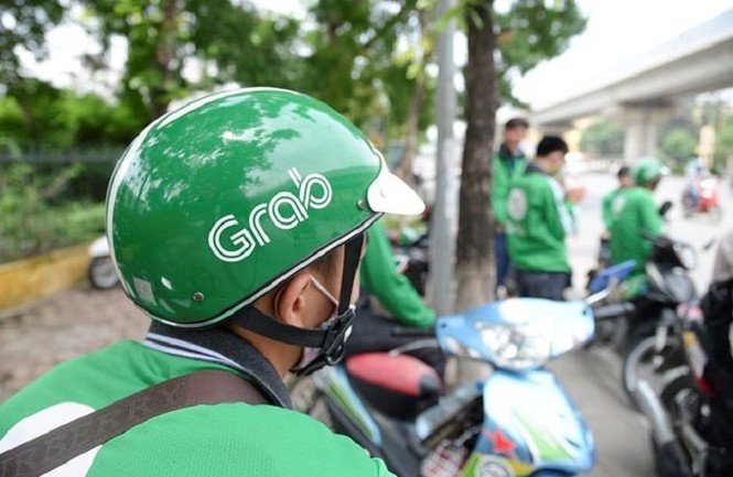 Grab bị tố tăng giá cước sau khi thâu tóm Uber - ảnh 1