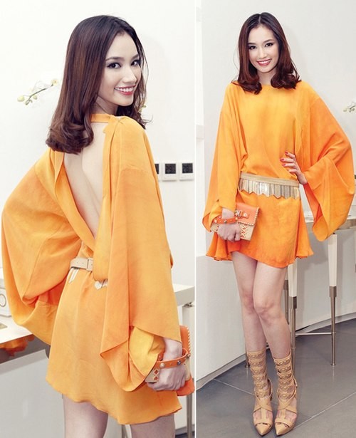 Trong buổi khai trương một cửa hàng, Trúc Diễm diện chiếc váy ngắn hở lưng