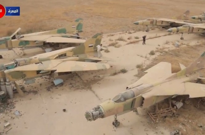 Tan hoang căn cứ Syria bị phiến quân phá hủy - ảnh 10