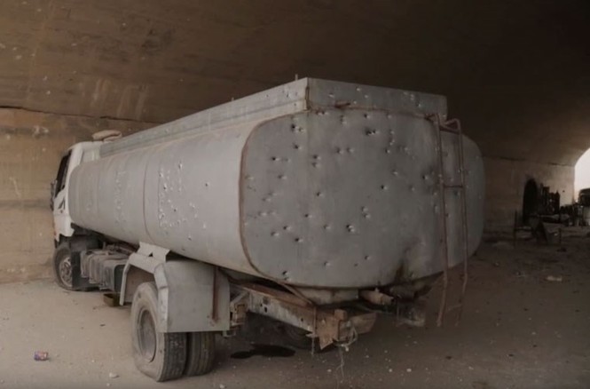 Tan hoang căn cứ Syria bị phiến quân phá hủy - ảnh 4