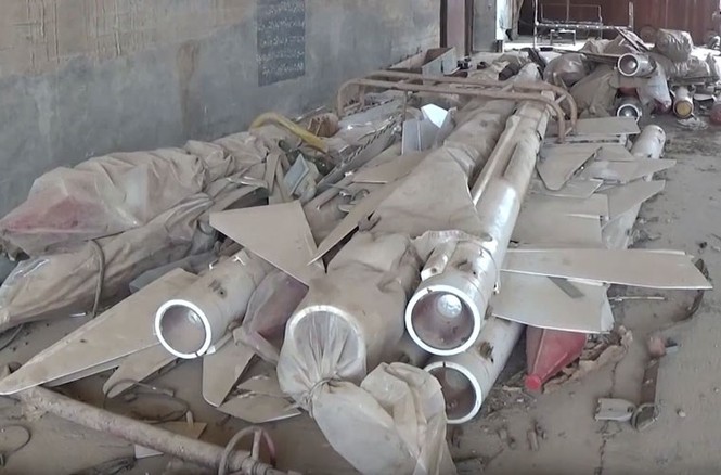 Tan hoang căn cứ Syria bị phiến quân phá hủy - ảnh 6