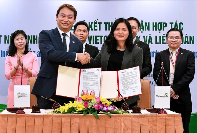 Vietcombank và Liên đoàn chế tạo Singapore ký thỏa thuận hợp tác toàn diện - ảnh 1