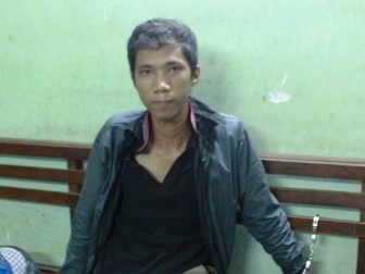 Nguyễn Thái Sơn bị bắt tại cơ quan công an. Ảnh: Pháp luật & xã hội