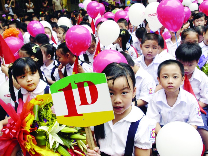 Học sinh lớp 1 trường THCS Quang Trung - Quận Hoàn Kiếm - TP Hà Nội, ngày khai giảng. Ảnh: Phạm Yên