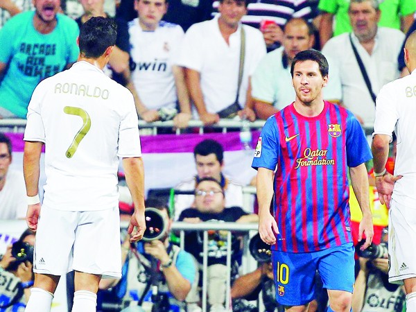 El Clasico không chỉ là cuộc đấu của Real và Barca mà còn là cuộc chiến của Messi và Ronaldo cho những kỷ lục mới Ảnh: Getty Images