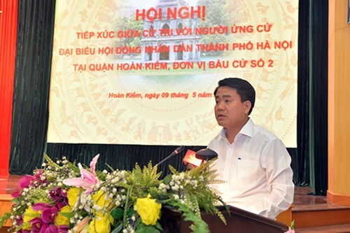 Chủ tịch UBND TP Hà Nội Nguyễn Đức Chung trình bày chương trình hành động.