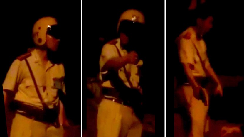 Hình ảnh CSGT trong video ghi lại việc chửi mắng, rút súng dọa dân. Ảnh chụp từ clip