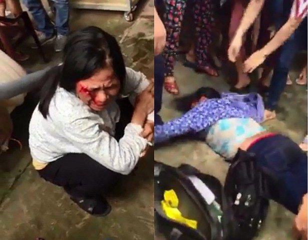 Hai người phụ nữ nghi bắt cóc trẻ em đã bị người dân thôn Thái Phù giữ lại và hành hung. Ảnh cắt từ clip