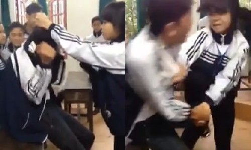 Nữ sinh lên gối đánh bạn trai ngay tại lớp. Ảnh cắt từ clip