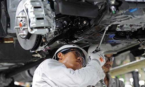 Công nhân trong một nhà máy sản xuất xe hơi tại Thái Lan. Ảnh: AFP