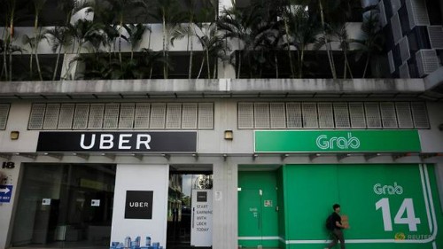 Một góc văn phòng của Uber và Grab chụp vào ngày 26/3/2018. Ảnh: Reuters