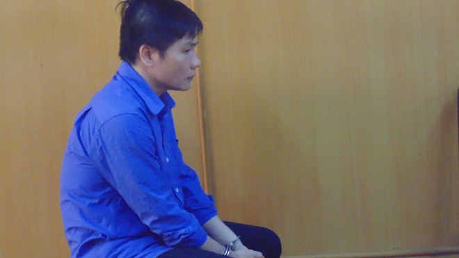 Giám đốc trốn nã Nguyễn Quang Huy tại tòa ngày 3/6. Ảnh: Tân Châu