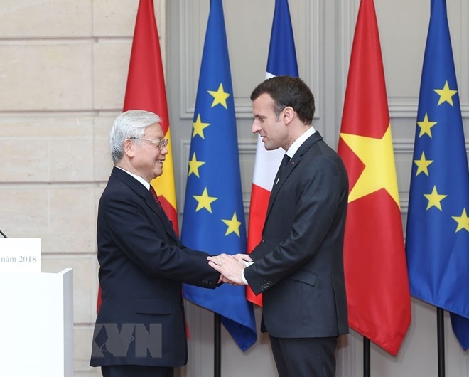 Tổng Bí thư Nguyễn Phú Trọng và Tổng thống Cộng hòa Pháp Emmanuel Macron. (Ảnh: Trí Dũng/TTXVN). 