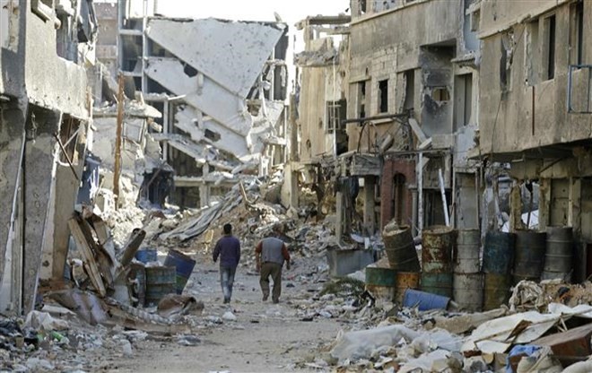 Cảnh tàn phá sau các cuộc xung đột ở Damascus, Syria ngày 3/11. (Ảnh: AFP/TTXVN)