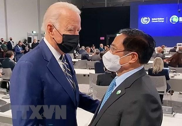 Thủ tướng Phạm Minh Chính gặp Tổng thống Mỹ Joe Biden tại hội nghị. (Ảnh: TTXVN)