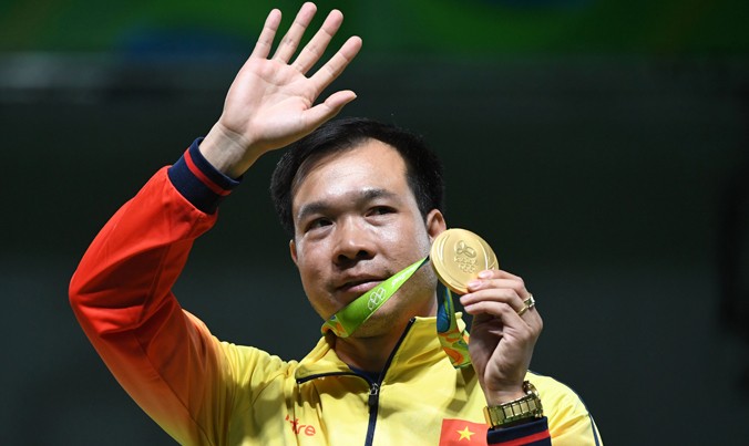 Xạ thủ Hoàng Xuân Vinh giành HCV Olympic đầu tiên cho Việt Nam. Ảnh: Tuấn An.