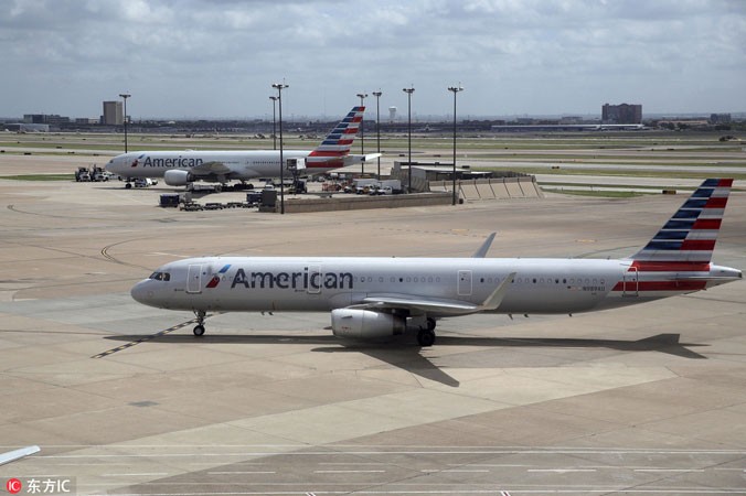 Do nhiều yếu tố trong đó có tác động của cuộc chiến thương mại Mỹ-Trung, hãng American Airlines đã phải đóng cửa hai tuyến bay thẳng qua Trung Quốc. Ảnh: China Daily.