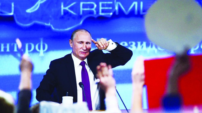 Tổng thống Nga Vladimir Putin thảo luận khủng hoảng tiền tệ, tình hình Ukraine và quan hệ với phương Tây trong cuộc họp báo cuối năm 2014. Ảnh: Getty Images