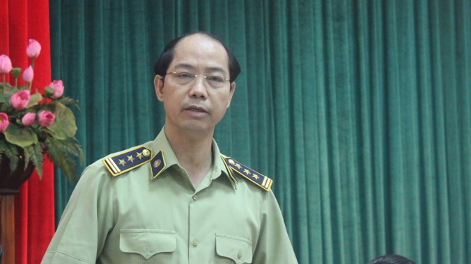 Ông Nguyễn Đắc Lộc, Phó Chi cục trưởng Chi Cục Quản lý thị trường Hà Nội trao đổi thông tin tại cuộc họp.