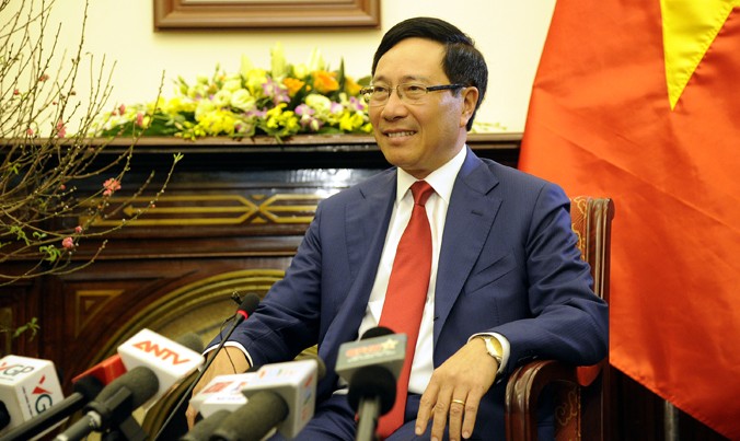Phó Thủ tướng, Bộ trưởng Ngoại giao Phạm Bình Minh trả lời báo chí ngày 5/1 tại Hà Nội. Ảnh: Trúc Quỳnh