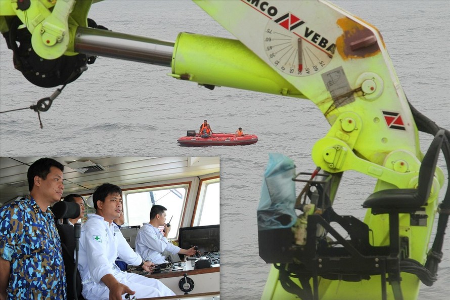 Lực lượng cứu hộ dùng robot hải quân tiếp cận tàu cá bị chìm. ảnh: PV