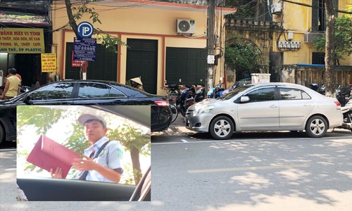 Nhân viên trông giữ xe trên phố Thái Phiên (ảnh) yêu cầu chủ phương tiện phải trả 50.000 đồng sau khi đỗ xe Ảnh: T.Đ 