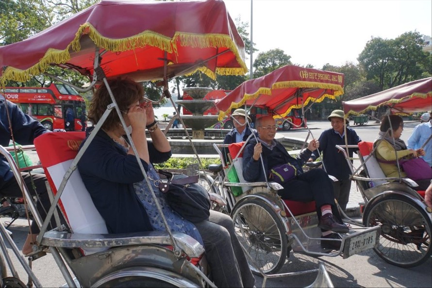 Nhiều du khách nước ngoài ưa thích dịch vụ xích lô tại Hà Nộiảnh: Nguyễn Thắng