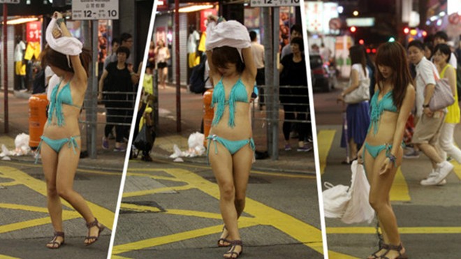 Cô gái cởi bỏ chiếc váy trắng để khoe thân trong bikini. Ảnh: Shanghaiist