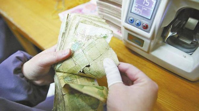 Tiền giấy cũ, rách có thể được xử lý để tạo thành điện năng. Ảnh: Shanghaiist