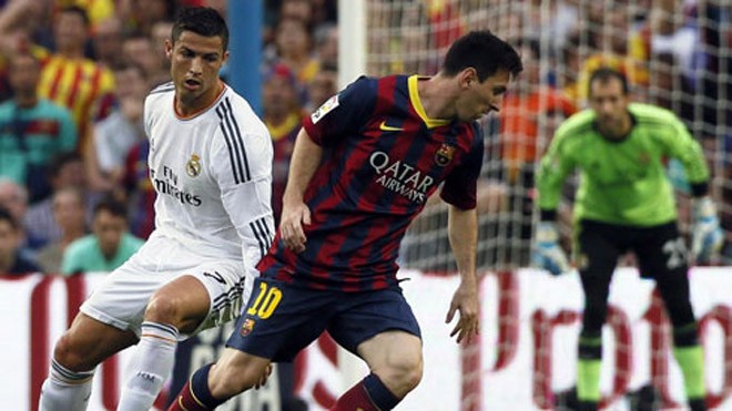 Cuộc đua giữa Real và Barca bị hoãn đúng giai đoạn gay cấn. Ảnh: Reuters.