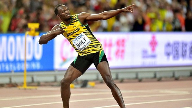 Usain Bolt vừa giành HCV nội dung chạy 100 m tại giải VĐTG diễn ra ở Bắc Kinh, Trung Quốc. Ảnh: Getty Images.