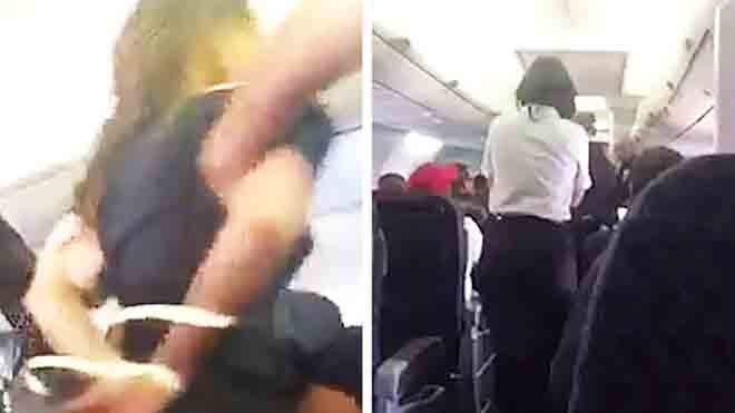 Cảnh sát áp giải nữ hành khách gây rối trên chuyến bay của hãng hàng không American Airlines (ảnh: Telegraph)