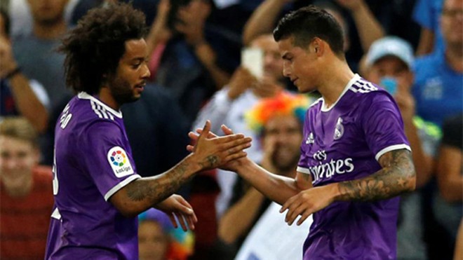 Marcelo (trái) cùng James góp công làm nên chiến thắng cho Real. Ảnh: Reuters