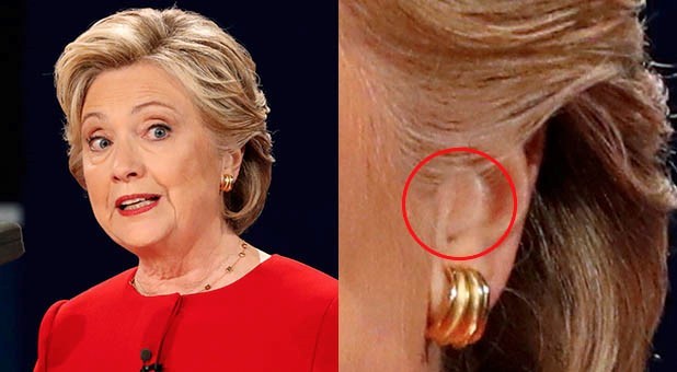Thiết bị lạ màu da bà Hillary đeo bên tai. Ảnh: Reuters