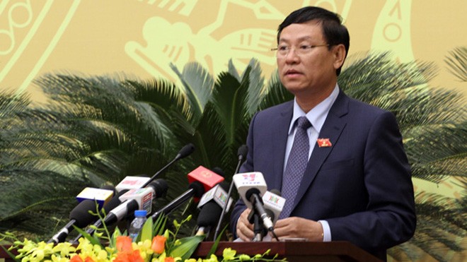 Chánh án Tòa án nhân dân TP Hà Nội Nguyễn Hữu Chính báo cáo tại kỳ họp HĐND