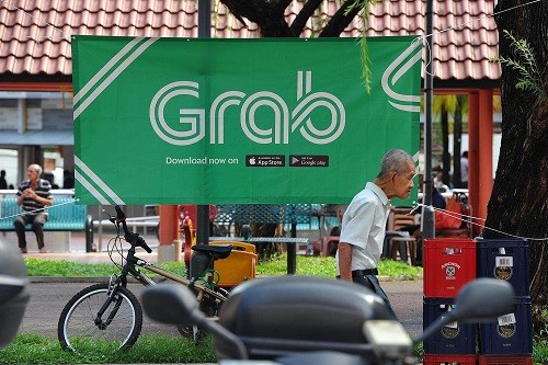 Grab là hãng cung cấp dịch vụ đi chung xe lớn nhất Đông Nam Á. Ảnh: Business Times